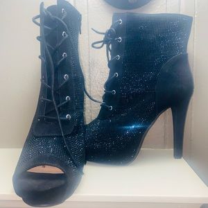 Black lace up pointed heel bootie, open toe. Torrid size 8.